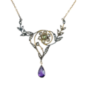 An Art Nouveau era Suffragette necklace with amethyst, pearl, and peridot set in 9K gold.