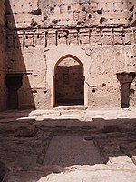 The former reception hall and throne room inside the western pavilion, the Qubba al-Khamsiniya. In the foreground are the remains of a rectangular water basin covered in zellij mosaic tilework.