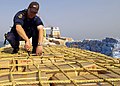 Image 3A sailor from HMAS Adelaide inspecting a ship in the Persian Gulf during 2004 (from History of the Royal Australian Navy)