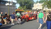 A red turn-of-the-20th-century-style car