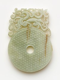 Disk (bi) with knobs, feline and dragon. Nephrite. Han dynasty, between 100 and 220 CE