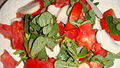 Leaves and tender stems coarsely chopped in salad, with tomato and onion.