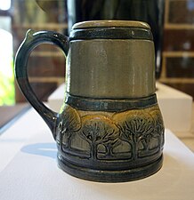 Mug with oak tree decoration, painted by Marie de Hoa LeBlanc (1907)