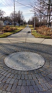 1st Avenue entry to Illinois Prairie Path with Maywood logo