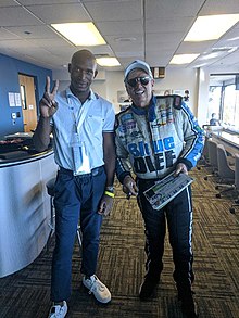 John Force & NHRA Coin creator Joshua Dixon at the 2021 Winternationals