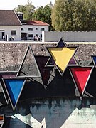 Various badges on a Dachau memorial^