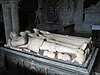 A tomb bearing the effigies of a man and a woman, their hands held in prayer