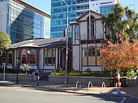 Italianate building in front of modern high rises