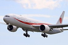 Aircraft takeoff. Side view of a twin-engine jet at takeoff with flaps and landing gear extended.