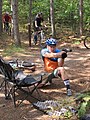 Bike biathlon competition using handguns.