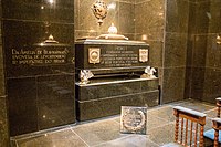 The graves of Emperor Pedro I of Brazil (also King of Portugal as Pedro IV) and his two wives Maria Leopoldina (not pictured, facing his grave) and Amélie (left), in the Monument to the Independence of Brazil, are made of green granite. The walls as well as the floor are clad with the same material.[80]