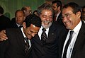 Bebeto de Freitas, a la dreta del jugador Túlio i del president Lula.