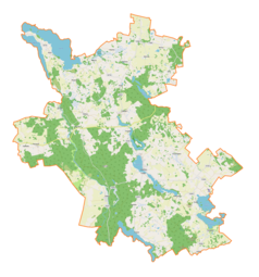 Mapa konturowa gminy Świętajno, u góry po lewej znajduje się owalna plamka nieco zaostrzona i wystająca na lewo w swoim dolnym rogu z opisem „Łaźno”