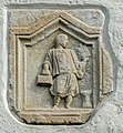 English: Ancient Roman relief on the west wall showing a Roman scrivener Deutsch: Römerstein an der West-Wand mit Schreiberdarstellung