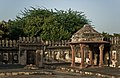 A grave under a pillared pavilion, chhatri, courtyard of Jamali Kamali mosque.