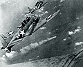 SBDs over the burning Japonese cruiser Mikuma, 6 June 1942