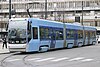 A blue, double-articulated low-floor tram