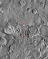 Imagem em vista ampla da THEMIS das seguintes imagens da HiRISE. O quadrado preto mostra a localização aproximada das imagens da HiRISE. Essa imagem é apenas parte de uma vasta área conhecida como Aureum Chaos. Clique na imagem para visualizar detalhes.