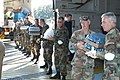 Georgia Defense Force members unload water and ice in anticipation of incoming Hurricane Katrina evacuees.