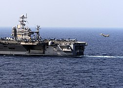 A French Rafale M prepares to land aboard the aircraft carrier USS Theodore Roosevelt (CVN 71) during combined French and American carrier qualifications