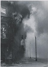 IPN copy #27 A housing block being destroyed Zamenhofa Street looking North, with burning Zamenhofa 25 / Wołyńska 2 on the left.