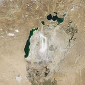 August 2009 – The Eastern Sea's mud flats have dried further, with only the faintest glimmer of water where it drains into the Western Sea. Barsakelmes Lake appears between the Northern and Western seas.