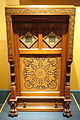 Daniel Pabst, Modern Gothic cabinet (c. 1875), Brooklyn Museum. Also features a cameo-carved panel and reverse-painted glass tiles.