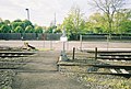 An un-gated pedestrian crossing west of the platforms.