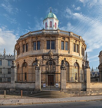 Sheldonian Theatre in Oxford seen from Broad Street, in evening light.