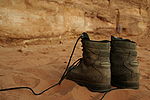 My own hiking boots on fine red desert sand.