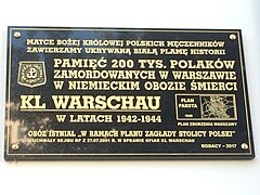 Commemorative plaque placed in 2017, which follows Trzcińska's hypothesis of the camp's history. The plaque reads: "We consecrate the white blot of history that was being hidden [from us] to Our Lady, the Queen of Polish martyrs: In homage to the 200,000 Poles murdered in Warsaw in the German extermination camp KL WARSCHAU in 1942-1944. The camp existed 'in the framework of the annihilation of the Capital of Poland' - from the Sejm resolution dated 27 July 2001 on the victims of KL Warschau. Compatriots - 2017" To the right, a scheme of Warsaw appears with the caption "Pabst Plan - 1940 - Plan of Warsaw's destruction".