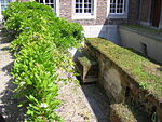 Fragment stadsmuur in de kloostertuin