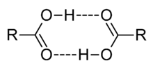 Liaison hydrogène entre des molécules d'acides.