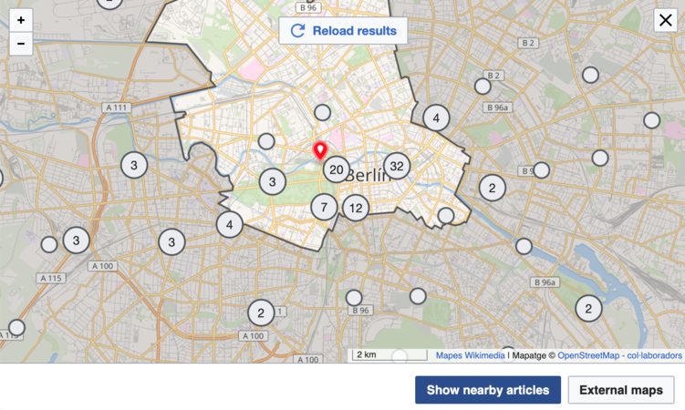 This screenshot shows the "show nearby articles" button at the bottom of the map. This example also shows a cluster of two nearby articles and the reload button at the top of the map.