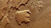 The large block in this image was separated from the nearby elevated areas by tectonic activity in Mars' past.[34]