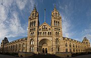 The Natural History Museum in London has an ornate terracotta facade typical of high Victorian architecture. The carvings represent the contents of the Museum.