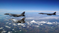 A Romanian F-16 escorts two B1B Lancers during a training mission, May 2020