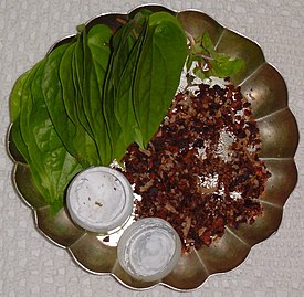 Betel leaf with betel nuts and lime.