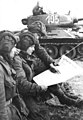 Image 3Soldiers in an East German tank unit reading about the erection of the Berlin Wall in 1961 in Neues Deutschland (from Newspaper)