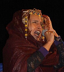 Malouma performing in 2004