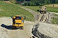 * Nomination Caterpillar 730 dump trucks at work, Saint-Martial, Charente,France. --JLPC 17:01, 16 August 2013 (UTC) * Promotion White stones are a bit OE, no problem with that, but it also look a bit unsharp --Christian Ferrer 22:22, 16 August 2013 (UTC)  Done : new file uploaded. --JLPC 10:03, 17 August 2013 (UTC)  Support Ok for a bit because background is nearly blurred, but trucks are sharp enough --Christian Ferrer 13:40, 17 August 2013 (UTC)