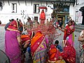 Women preparing the Holika Dahan bonfire at Thapathali, Kathmandu. Nepal