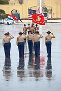 USMC drill instructors salute the national ensign during a graduation ceremony at MCRDPSD, 2013