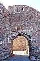 Fortress gate with depictions of lions above