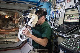 ISS-50 Shane Kimbrough uses a virtual reality headset in the Destiny lab.jpg