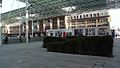 Hoarding with SNCF commercial advertising on the square of the station during work reconstruction.