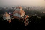 Temple at sunrise from the top of nearby water tank. the entrance to the main kali temple can be seen at center.