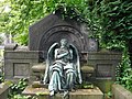 Sleeping Chronos, god of time, at gravesite of Georg Wolff, died in 1904, at Friedhof IV der Gemeinde Jerusalems- und Neue Kirche