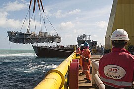 Superstructure being lifted from USS Guardian.jpg