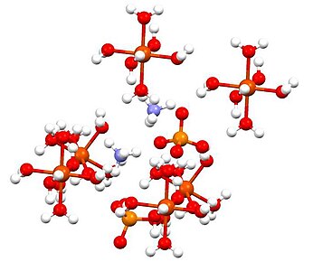 Sel unit fero amonium sulfat (N berwarna ungu, O berwarna merah, S berwarna oranye, Fe berwarna merah besar).